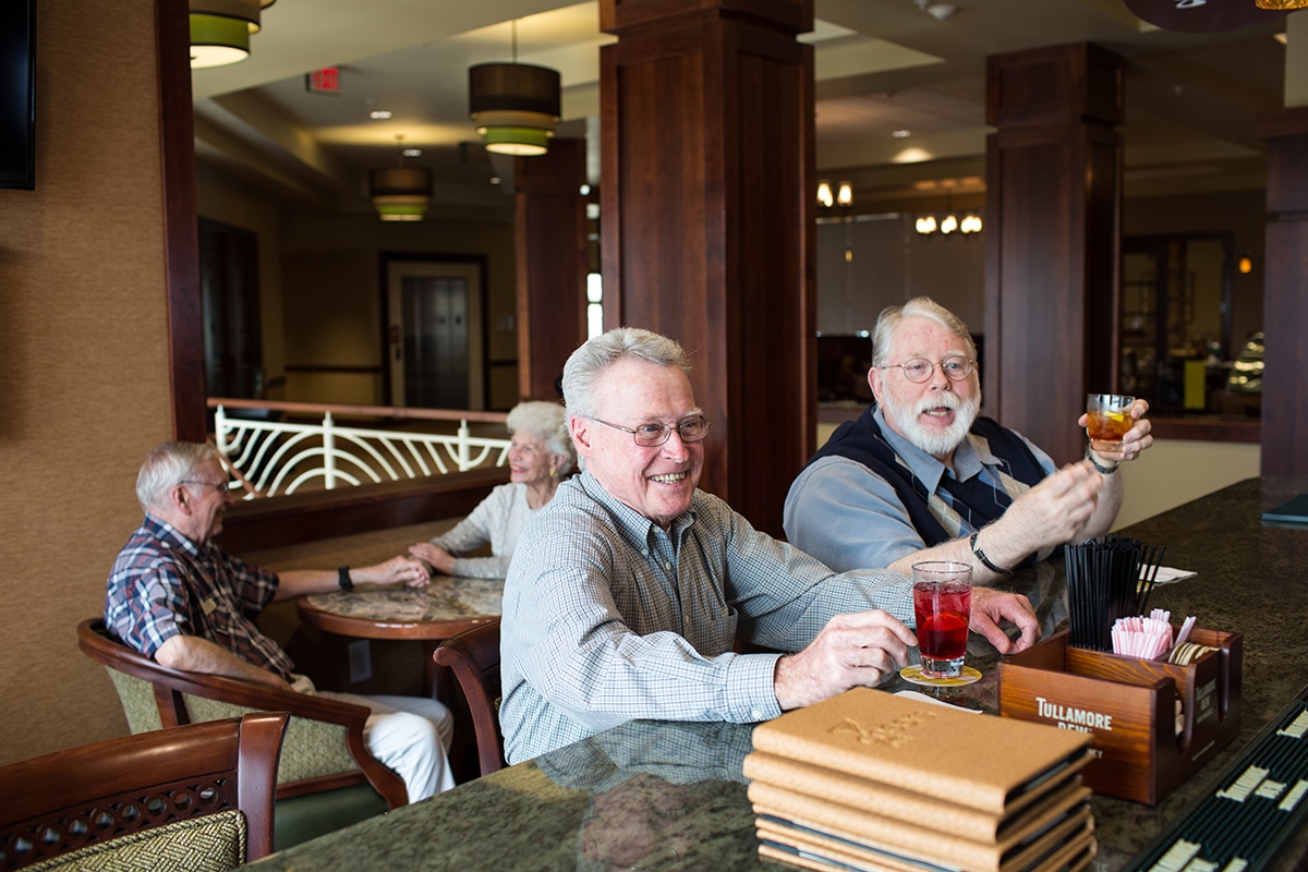 image of two men having a drink at the pub Hillcrest Country Estates Grand Lodge